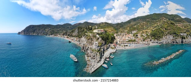 Monterosso al Mare village with colorful houses in the Cinque Terre on the famous Ligurian coast high on a cliff tourist attraction in the northwest of Italy. - Powered by Shutterstock