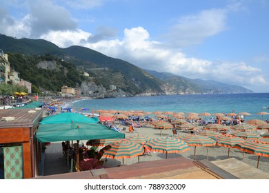 Monterosso, Cinque Terre, Italy - 22nd September 2012: The Beach And Colorful Umbrellas At Monterosso