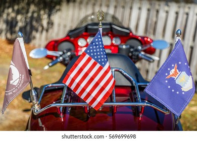 MONTGOMERY, ALABAMA - 24 JANUARY, 2017: Patriotic Bike Or Motorcycle:  Rear Angle Of The Motorcycle Of A Military Veteran With The American, POW/MIA And United States Air Force Flags Displayed.