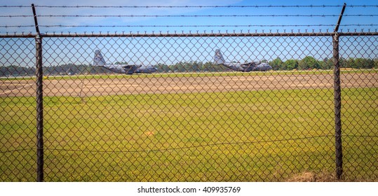 MONTGOMERY, ALABAMA - MARCH 29, 2016: C-130 Aircraft Taxi: Two Military Mission Design Series C-130 Aircraft As They Taxi The Runway Just Before Takeoff At Maxwell Air Force Base, Montgomery, Alabama.