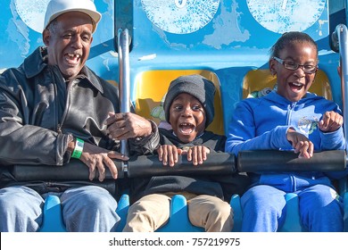 Montgomery, Alabama, USA - October 29, 2017: An African American Family Enjoys One Of The Carnival Rides At The Alabama National Fair.