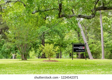 Montgomery, USA - April 21, 2018: Sign For Private Liberal Arts Huntingdon College In Alabama With Green Park Entrance