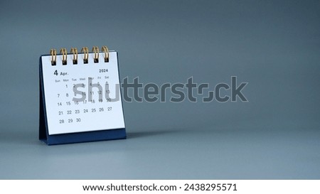 Month of April 2024 calendar on gray background with copy space