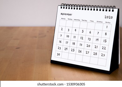 Month Page: November In 2020 Paper Calendar With Funny Font On The Wooden Table