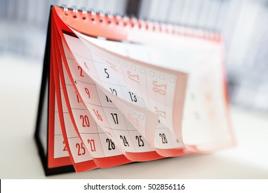 Months and dates shown on a calendar whilst turning the pages - Shutterstock ID 502856116