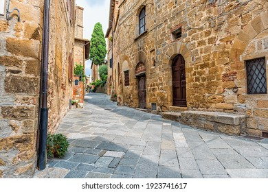 Monticchiello, Italy In Tuscany With Empty Street In Small Town Village And Plants On Brick Stone House Exterior Nobody