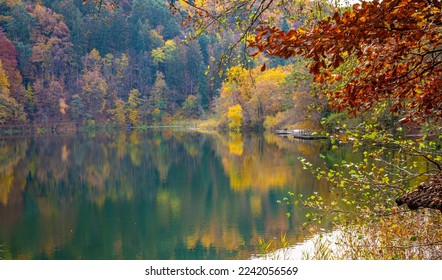 Monticolo lake in Autumn season - (Montiggler Seen )Appiano, Bolzano province, Trentino Alto-Adige, South Tyrol, northern Italy, Europe - - Shutterstock ID 2242056569