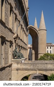 Montpellier, France - 07 26 2022 : Cityscape Side View Of The Historic Faculty Of Medicine Entrance With Ancient Portal Of Landmark St Peter Cathedral In Background On A Sunny Summer Afternoon