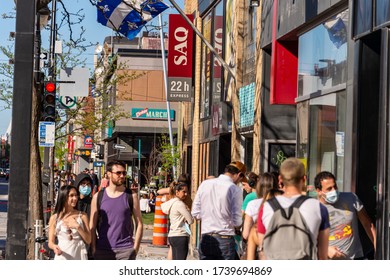 Montreal, CA - 23 May 2020 : Customers In A Line Outside Of SAQ Liquor Store In Montreal