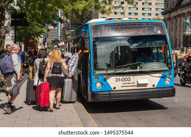 Montreal, CA - 3 September 2019: People Boarding The 747 Bus Going To Montreal Trudeau Airport On René Lévesque Bld.