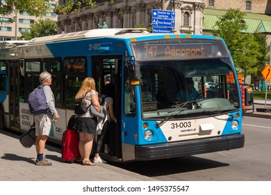 Montreal, CA - 3 September 2019: People Boarding The 747 Bus Going To Montreal Trudeau Airport On René Lévesque Bld.