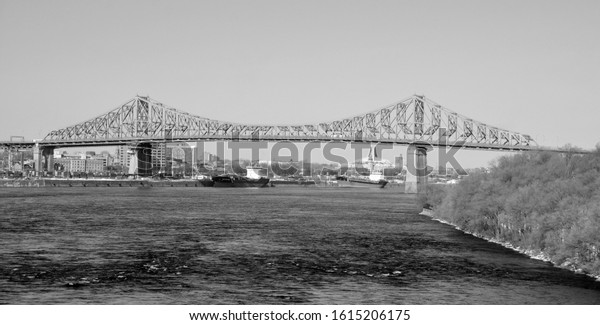 MONTREAL CANADA\
01 10 2020: The Jacques Cartier Bridge is a steel truss cantilever\
bridge crossing the Saint Lawrence River from Montreal to Longueuil\
in Montreal, Quebec,\
Canada