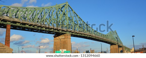 MONTREAL CANADA\
02 07 2019: The Jacques Cartier Bridge is a steel truss cantilever\
bridge crossing the Saint Lawrence River from Montreal to Longueuil\
in Montreal, Quebec,\
Canada