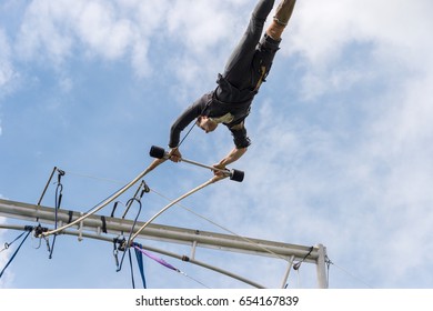 Montreal, Canada - 4 June 2017: Trapeze artist performing outside In Jeanne Mance Park