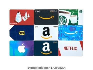 Montreal, Canada - April 9, 2020: Different gift cards of many brands such as Amazon, Netflix, Xbox, Google Play, Best Buy, Spotify, Starbucks. A gift card is prepaid card of a store or service
