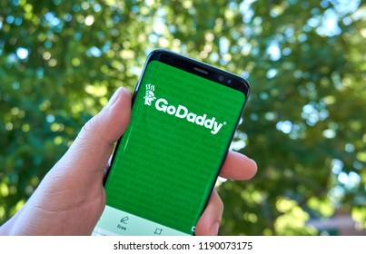 MONTREAL, CANADA - August 28, 2018: Godaddy android app on Samsung s8 screen in a hand.