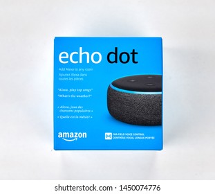 MONTREAL, CANADA - DECEMBER 17, 2018: Amazon Echo and Echo Dot with box over white background. Amazon Echo and Echo Dot are a brand of smart speakers developed by Amazon.