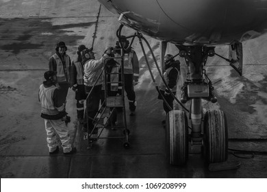 Montreal, Canada - February 13, 2018: A team of aircraft technicians receive instructions on the tarmac at Montreal's Pierre Elliott Trudeau International Airport.