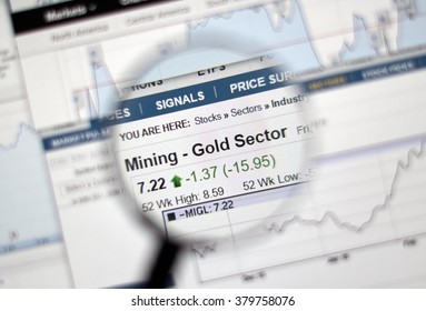 MONTREAL, CANADA - FEBRUARY, 2016 - Mining - Gold Sector Of Stock Market Under Magnifying Glass.