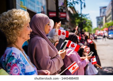 Montreal, Canada - July 1 2019: People Gathering At Downtown Montreal Watching The Canada Day Parade