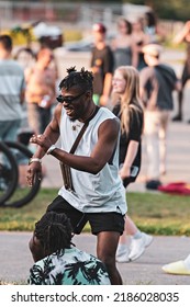 MONTREAL, CANADA - July 2022: Black Man Dancing At Tam-Tams  Weekly Free Festival Around The George-Étienne Cartier Monument In Mount Royal Park In Montreal, Quebec, Canada