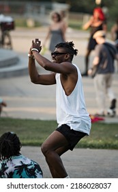 MONTREAL, CANADA - July 2022: Black Man Dancing At Tam-Tams  Weekly Free Festival Around The George-Étienne Cartier Monument In Mount Royal Park In Montreal, Quebec, Canada