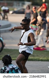 MONTREAL, CANADA - July 2022: Black Man Dancing At Tam-Tams  Weekly Free Festival Around The George-Étienne Cartier Monument In Mount Royal Park In Montreal, Quebec, Canada