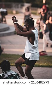 MONTREAL, CANADA - July 2022: Black Man Dancing At Tam-Tams  Weekly Free Festival Around The George-Étienne Cartier Monument In Mount Royal Park In Montreal, Quebec, Canada