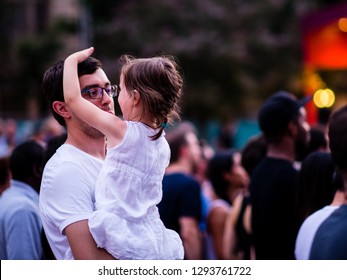 Montreal, Canada - July 4 2018: Father And Daughter Enjoying The Outdoor Concert In Monteral Place Des Arts