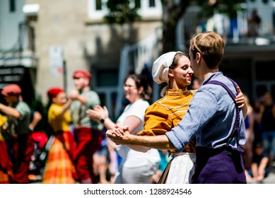 Montreal, Canada - June 24 2017: People With 19th Century Costume Dancing In The Quebec Day Parade In Montreal Downtown