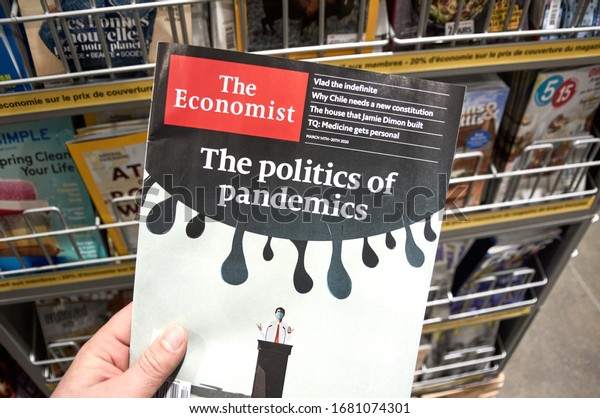Montreal, Canada - March 23, 2020: The Economist\
magazine with The Politics of Pandemics title. The Economist is an\
English-language weekly magazine-format newspaper owned by the\
Economist Group.