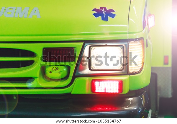 Montreal, Canada -  March 25, 2018: Ambulance\
car in the hospital park. Canadian ambulance car with lights and\
siren in action. Emergency lights flashing  on city road. American\
ambulance vehicle.