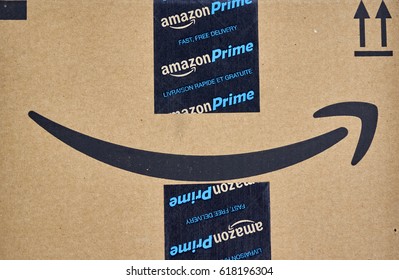 MONTREAL, CANADA - MARCH 28, 2017: Amazon Prime Shipping Box With Branded Tape On It. Amazon Is An American Electronic Commerce And Cloud Computing Company.