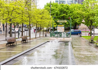 Montreal, Canada - May 26, 2017: Victoria Square Metro station park with fountains during rainy cloudy day in city in Quebec region