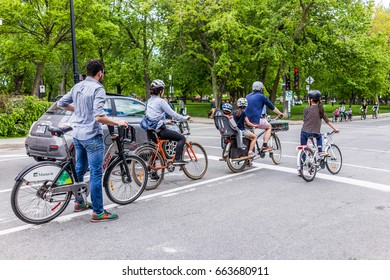 Montreal, Canada - May 27, 2017: Group Of People Family Riding On Manuvie Bicycles In Plateau Neighborhood Of City In Quebec Region On Laurier Avenue By Park