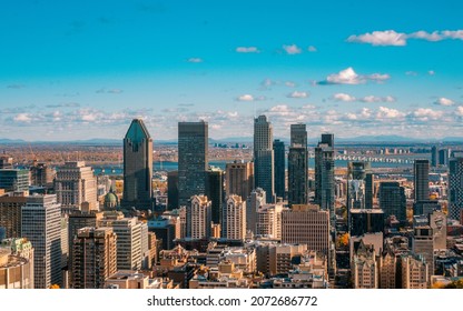 Montreal, Canada - November 10, 2021: Montreal Skyline And Buildings On A Sunny Fall Day With Clouds 