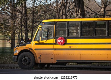 MONTREAL, CANADA - NOVEMBER 4, 2018: North American Yellow School Bus Parked, Waiting For Students, With The Text Translated In French, According To French Speaking Regulations Of Quebec

