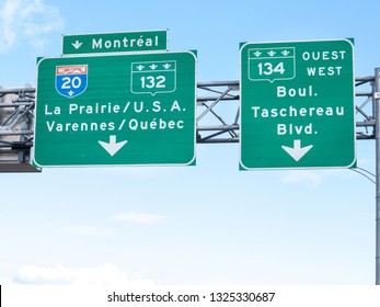 MONTREAL, CANADA - NOVEMBER 8, 2018: Highway Road Sign Indicating The Direction Of Montreal And The Way On The Interstate Motorway To The USA Canada Border With The United States Of America

