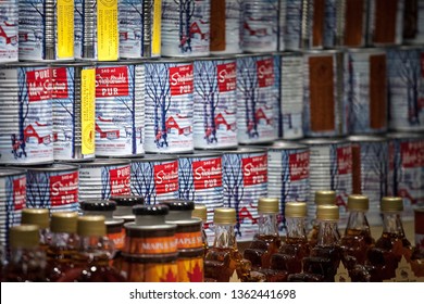 MONTREAL, CANADA - NOVEMBER 9, 2018: Maple Syrup metal can for sale on Montreal Jean Talon market. Quebec is the highest producer of Maple syrup in the world, and the symbol of Canada

