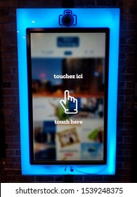 Montreal, Canada - October 23, 2019 - A Large Touchscreen Interactive Display At Travelodge Hotel