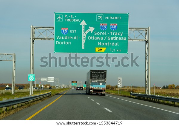 Montreal, Canada - October 28, 2019 - The view of the\
traffic on the highway towards the airports, and exits into Route\
20, Route 30 and Route 40\
