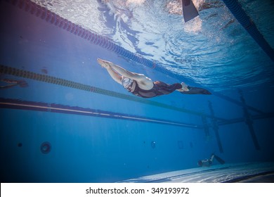 MONTREAL, CIRCA JUNE 2014 - Two Hot Spring Days of Freediving Competition at Jean-Drapeau 50m Outdoor Olympic Pool. Freediver Dynamic with Monofin Performance from Underwater