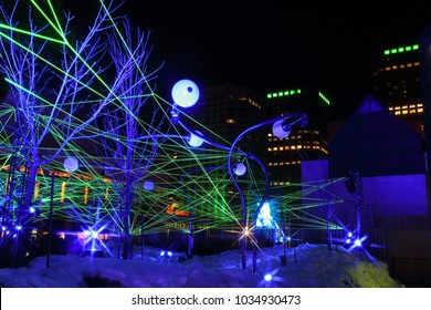 Montreal Festival Of Lights. Colorful Illuminated Silhouettes In The Night. Lighting Installations. Winter Festival Of Arts. Outdoor Family Activities. Entertainment District.

