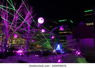 Montreal Festival Of Lights. Colorful Illuminated Silhouettes In The Night. Lighting Installations. Winter Festival Of Arts. Outdoor Family Activities. Entertainment District.

