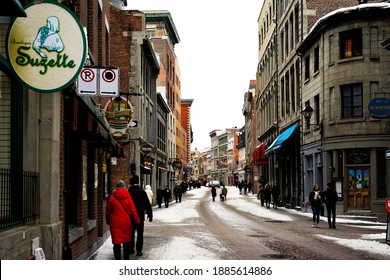 Montreal, January 1, 2021: The First Day Of The Year, A Lot Of People Walk On The Street In The Old Port Of Montreal. City Life During Winter Holidays In Pandemic Time.