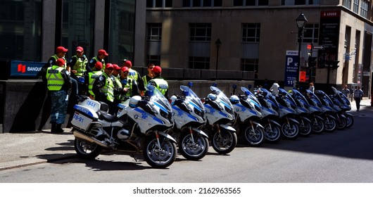 MONTREAL QC CANADA 19 05 2017: Montreal Motorcycle Cop In Service For The Little Giants Walking In The Street Of Montreal Of The City It Is The Second Largest Municipal Police Agency In Canada