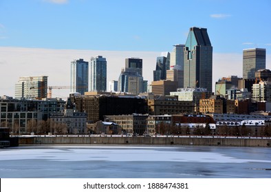 MONTREAL QUEBEC CANADA 01 06 2021: The Old And Downtown Montreal  Region Reflection On Ice Of The  Saint Laurent (Lawrence) River In Winter Time