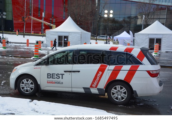 MONTREAL QUEBEC CANADA 03 24 2020: Car of\
GardaWorld Corporation is a Canadian private security firm, based\
in Montreal, Quebec, Canada on duty for the public protection\
during the covid-19\
pandemic.