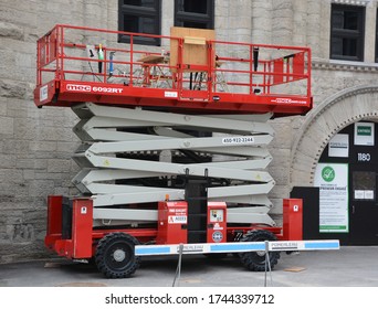 MONTREAL QUEBEC CANADA 05 26 2020: SCISSOR LIFT Ultra Deck Rough Terrain Construction Grade Dual Deck Rough Terrain