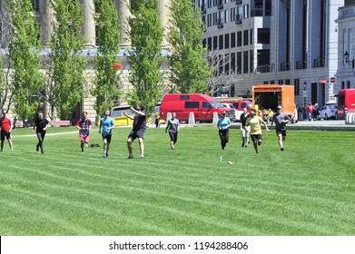 Montreal, Quebec/ Canada- 06/14/2016: Young People Enjoy A Game Of Frisbee Golf On The Champ De Mars. 